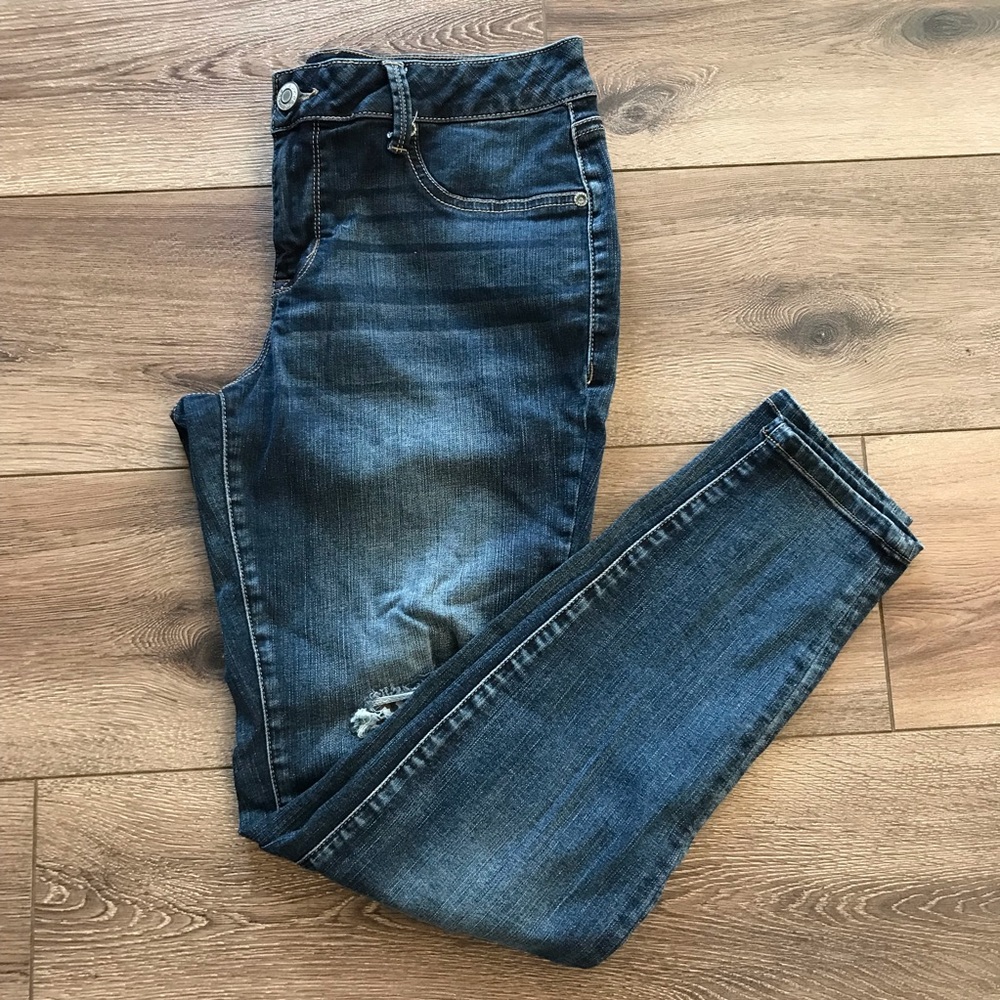 Midrise destructed jeggings backed w/animal prints